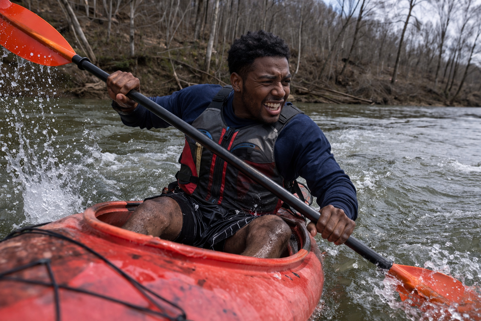 Person kayaking through water