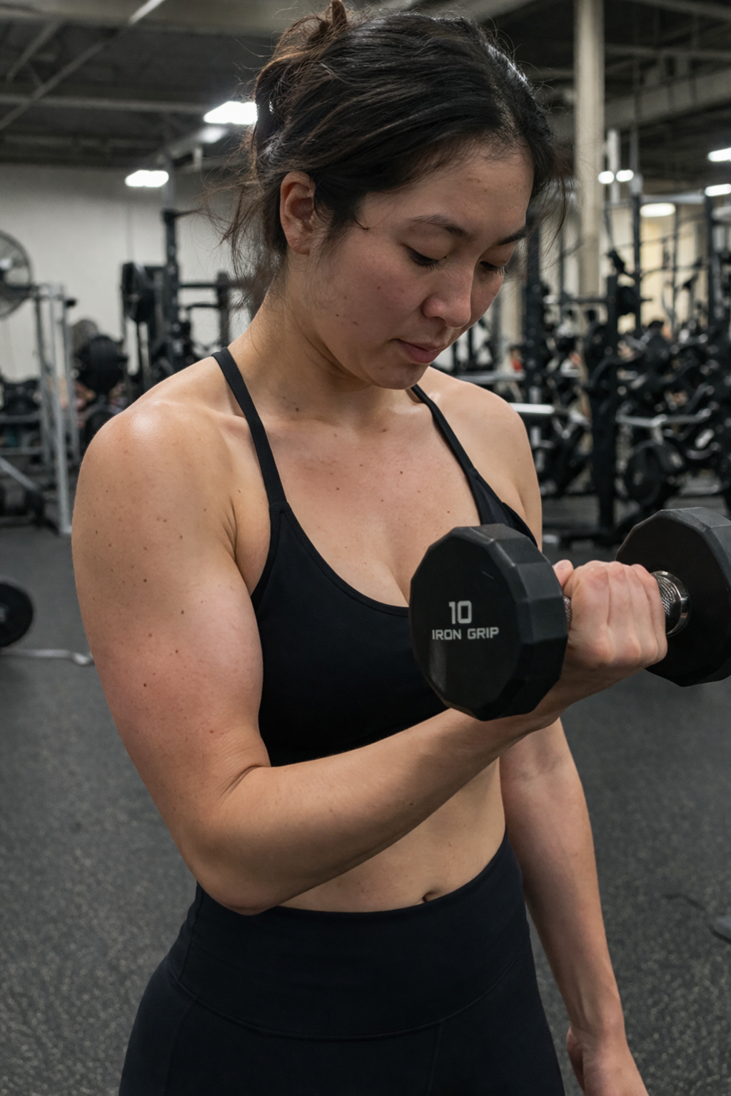 Woman resting between strength training sets